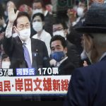 
              A pedestrian looks at a public TV showing Fumio Kishida, former foreign minister, with a live broadcast of the Liberal Democratic Party (LDP}'s presidential election Wednesday, Sept. 29, 2021, in Tokyo. Kishida has won the governing party leadership election and is set to become the next prime minister. The Japanese letters read: "Fumio Kishida new LDP president." (AP Photo/Eugene Hoshiko)
            