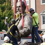 
              Crews remove the torso of Confederate General Robert E. Lee,  one of the country's largest remaining monuments to the Confederacy, on Monument Avenue in Richmond, Va., Wednesday, Sept. 8, 2021. (AP Photo/Steve Helber)
            