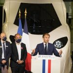 
              French President Emmanuel Macron speaks in front of a life-size replica of the next high-speed train TGV, at the Gare de Lyon station Friday, Sept. 17, 2021 in Paris. France unveils a super-fast, climate-friendly train of the future, the next generation of its high-speed TGV trains that have been emulated around the world. French President Emmanuel Macron and other government officials are holding a ceremony at the historic Gare de Lyon train station in Paris to mark 40 years since the unveiling of the first TGV, or "train a grand vitesse." (AP Photo/Michel Euler, Pool)
            