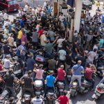 
              Motorcycle drivers wait to get fuel at a gas station in Beirut, Lebanon, Tuesday, Aug. 31, 2021. Lebanon is struggling amid a two-year economic and financial crisis that the World Bank has described as among the worst the world has witnessed since the mid-1850s. The crisis has left Lebanese suffering from severe shortages in fuel and basic goods like baby formula, medicine and spare parts. (AP Photo/ Hassan Ammar)
            