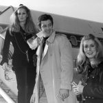 
              FILE - In this Nov. 29, 1968 file photo, actress Ursula Andress, left, joins Jean-Paul Belmondo, center, and Catherine Deneuve, right, on the gangway of the plane in Orly airport, France. French New Wave actor Jean-Paul Belmondo has died, according to his lawyer’s office on Monday Sept. 6, 2021.  (AP Photo/File)
            