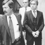 
              FILE - In this Aug. 28, 1979, file photo, a handcuffed Dr. Jeffrey MacDonald is led away from Federal Court in Raleigh, N.C., after a jury found him guilty of one count of first degree murder and the two counts of second degree murder. The former Army doctor convicted for the 1970 slayings of his wife and two young daughters at North Carolina's Fort Bragg has ended his appeal of a court ruling denying his requested release. The 4th U.S. Circuit Court of Appeals granted MacDonald's appeal dismissal on Thursday, Sept. 16, 2021. (AP Photo, File)
            