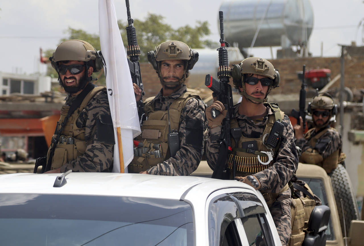 Taliban special force fighters arrive inside the Hamid Karzai International Airport after the U.S. ...