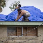 
              A roof is covered with tarps on Monday, Sept. 6, 2021, in Kenner, La., a week after Hurricane Ida swept through the area. (Chris Granger/The Times-Picayune/The New Orleans Advocate via AP)
            