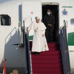 
              Pope Francis walks down the steps on an airplane as he arrives at Budapest international airport, Sunday, Sept. 12, 2021. Francis is opening his first foreign trip since undergoing major intestinal surgery in July, embarking on an intense, four-day, two-nation trip to Hungary and Slovakia that he has admitted might be overdoing it. (AP Photo/Gregorio Borgia)
            