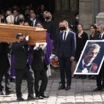 
              Pallbearers carry the coffin of actor Jean-Paul Belmondo after his funeral service at the Saint Germain des Pres church, Friday, Sept. 10, 2021 in Paris. The star of the iconic French New Wave film "Breathless" died Monday aged 88. (AP Photo/Michel Euler)
            