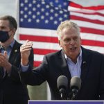 
              FILE - In this April 8, 2021 file photo, former Virginia Gov. Terry McAuliffe, right, gestures during a news conference with Virginia Gov.Ralph Northam, left, at Waterside in Norfolk, Va. McAuliffe won Virginia's 2013 governor's race by embracing his own brand of personal politics that rely on decades-old friendships, back-slapping charisma and tell-it-like-it-is authenticity. (AP Photo/Steve Helber, File)
            