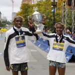 
              Benson Kipruto, left, and Diana Kipyogei, both of Kenya, celebrate winning the men's and women's divisions of the 125th Boston Marathon on Monday, Oct. 11, 2021, in Boston. (AP Photo/Winslow Townson)
            