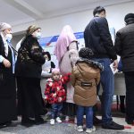 
              People line up to cast vote at a polling station during the presidential election in Tashkent, Uzbekistan, Sunday, Oct. 24, 2021. President Shavkat Mirziyoyev, who has relaxed many of the policies of his dictatorial predecessor but has made little effort at political reform, is expected to win a new term by a landslide against weak competition in an election Sunday.(AP Photo)
            