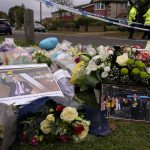 
              Flowers are laid near the Belfairs Methodist Church in Eastwood Road North, in Leigh-on-Sea, Essex, England, Saturday, Oct. 16, 2021 where British Conservative lawmaker David Amess died after being stabbed at a constituency surgery on Friday. Leaders from across the political spectrum came together Saturday to pay their respects to Amess who was stabbed to death in what police say was a terrorist-related attack. (AP Photo/Alberto Pezzali)
            