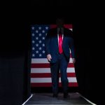 
              FILE - In this June 20, 2020, file photo, President Donald Trump arrives on stage to speak at a campaign rally at the BOK Center, in Tulsa, Okla. Reports of hateful and violent speech on Facebook poured in on the night of May 28 after President Donald Trump hit send on a social media post warning that looters who joined protests following Floyd's death last year would be shot, according to internal Facebook documents shared with The Associated Press. (AP Photo/Evan Vucci, File)
            