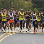 
              The elite men break from the starting line of the 125th Boston Marathon, Monday, Oct. 11, 2021, in Hopkinton, Mass. (AP Photo/Steven Senne)
            