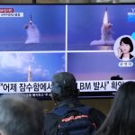 
              People watch a TV screen showing images of North Korea's ballistic missile launched from a submarine during a news program at Seoul Railway Station in Seoul, South Korea, Wednesday, Oct. 20, 2021. North Korea announced Wednesday that it had tested a newly developed missile designed to be launched from a submarine, the first such weapons test in two years and one it says will bolster its military's underwater operational capability.Korean letters read: on the top of screen read: "North Korea launched a ballistic missile from a submarine." (AP Photo/Ahn Young-joon)
            