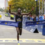 
              Benson Kipruto, of Kenya, approaches the tape to win the 125th Boston Marathon on Monday, Oct. 11, 2021, in Boston. (AP Photo/Winslow Townson)
            