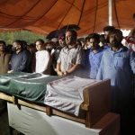 
              People attend the funeral prayer for Pakistani nuclear scientist Abdul Qadeer Khan, in Islamabad, Pakistan, Sunday, Oct. 10, 2021. Khan, a controversial figure known as the father of Pakistan's nuclear bomb, died Sunday of COVID-19 following a lengthy illness, his family said. He was 85. (AP Photo/Anjum Naveed)
            