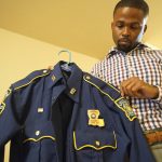 
              Former Louisiana State Police Trooper Carl Cavalier holds his uniform at his home in Houma, La. on Friday, Oct. 15, 2021. Cavalier, a Black state trooper who was once decorated for valor but recently fired in part for criticizing the agency’s handling of brutality cases, says, “If you’re a part of the good ol’ boy system, there’s no wrong you can do. (AP Photo/Allen G. Breed)
            