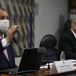 
              Senators Omar Aziz, left, and Renan Calheiros attend a session by their commission investigating the government's management of the COVID-19 pandemic at the Federal Senate in Brasilia, Brazil, Tuesday, Oct. 26, 2021. (AP Photo/Eraldo Peres)
            