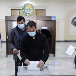 
              A man casts his ballot at a polling station during the presidential election in Tashkent, Uzbekistan, Sunday, Oct. 24, 2021. Uzbeks voted Sunday in a presidential election that the incumbent is expected to win in a landslide against weak competition. Although Shavkat Mirziyoyev has relaxed many of the policies of his dictatorial predecessor, he has made little effort at political reform. He took office in 2016 upon the death of Islam Karimov and faces four relatively low-visibility candidates who did not even show up for televised debates. (AP Photo)
            