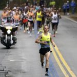 
              CJ Albertson, of Fresno, Calif., front, leads a group of elite men in the 125th Boston Marathon, Monday, Oct. 11, 2021, in Hopkinton, Mass. (AP Photo/Steven Senne)
            