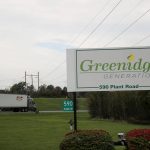 
              CORRECTS SPELLING OF GREENIDGE - A semi truck passes the entrance to the Greenidge Generation power plant, Friday, Oct. 15, 2021, in Dresden, N.Y. One Bitcoin mining operation in central New York came up with a novel solution in finding cheap energy to run the power-gobbling computer arrays that create and transact cryptocurrency: It took over Greenidge Generation which now produces about 44 megawatts to run 15,300 computer servers, plus additional electricity it sends into the state's power grid. (AP Photo/Julie Jacobson)
            