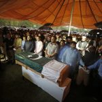 
              People attend the funeral prayer for Pakistani nuclear scientist Abdul Qadeer Khan, in Islamabad, Pakistan, Sunday, Oct. 10, 2021. Khan, a controversial figure known as the father of Pakistan's nuclear bomb, died Sunday of COVID-19 following a lengthy illness, his family said. He was 85. (AP Photo/Anjum Naveed)
            