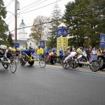 
              Participants in the women's wheelchair division break from the starting line of the 125th Boston Marathon, Monday, Oct. 11, 2021, in Hopkinton, Mass. (AP Photo/Mary Schwalm)
            