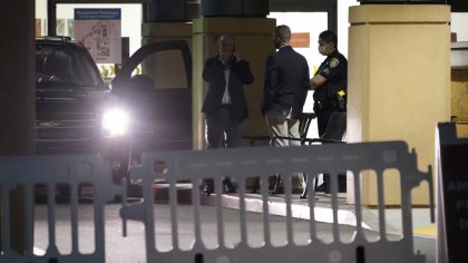 United States Secret Service special agents wait outside the University of California Irvine Medica...