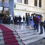 
              People stand in a line at a polling station during the presidential election in Tashkent, Uzbekistan, Sunday, Oct. 24, 2021. Uzbeks voted Sunday in a presidential election that the incumbent is expected to win in a landslide against weak competition. Although Shavkat Mirziyoyev has relaxed many of the policies of his dictatorial predecessor, he has made little effort at political reform. He took office in 2016 upon the death of Islam Karimov and faces four relatively low-visibility candidates who did not even show up for televised debates. (AP Photo)
            