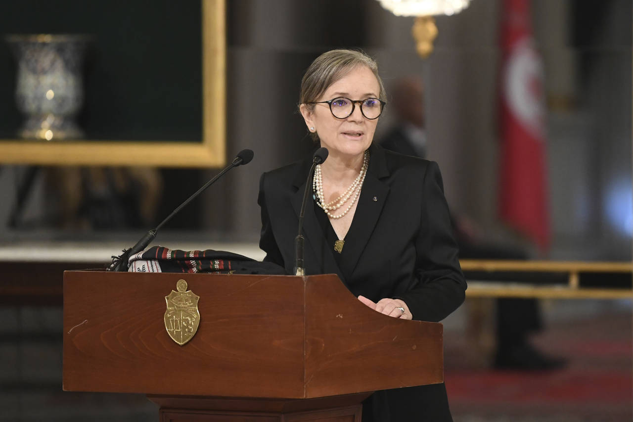 In this photo distributed by the Tunisian Presidency, Tunisian Prime Minister Najla Bouden talks du...