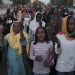 
              People protest in Khartoum, Sudan, two days after a military coup, Wednesday, Oct. 27, 2021. The coup threatens to halt Sudan's fitful transition to democracy, which began after the 2019 ouster of long-time ruler Omar al-Bashir and his Islamist government in a popular uprising. It came after weeks of mounting tensions between military and civilian leaders over the course and pace of that process. (AP Photo/Marwan Ali)
            