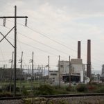 
              CORRECTS SPELLING OF GREENIDGE - Smokestacks from the Greenidge Generation power plant tower above the surrounding landscape, Friday, Oct. 15, 2021, in Dresden, N.Y. One Bitcoin mining operation in central New York came up with a novel solution in finding cheap energy to run the power-gobbling computer arrays that create and transact cryptocurrency: It took over Greenidge Generation which now produces about 44 megawatts to run 15,300 computer servers, plus additional electricity it sends into the state's power grid. (AP Photo/Julie Jacobson)
            