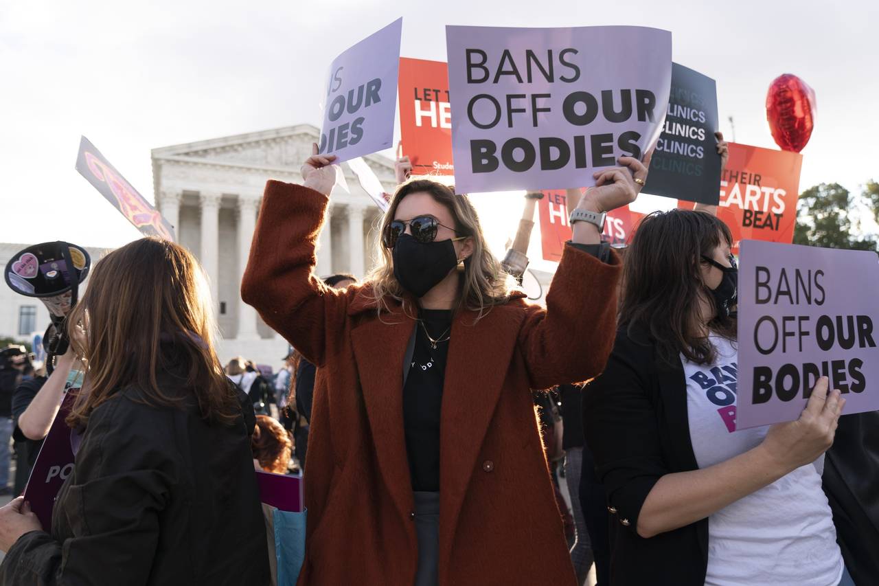 Emily Halvorson, center, of Washington, with Planned Parenthood, joins groups of abortion-rights an...