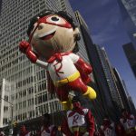 
              The Red Titan ballon makes its way down Sixth Avenue during the Macy's Thanksgiving Day Parade, Thursday, Nov. 25, 2021, in New York. The Macy's Thanksgiving Day Parade is returning in full, after being crimped by the coronavirus pandemic last year. The Thanksgiving parade is the latest U.S. holiday event to make a comeback amid the ongoing pandemic. (AP Photo/Jeenah Moon)
            