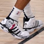 
              FILE - A depiction of George Floyd is seen on the shoes of Denver Nuggets' Jamal Murray (27) during the second half an NBA first round playoff basketball game against the Utah Jazz on Tuesday, Sept. 1, 2020, in Lake Buena Vista, Fla. (AP Photo/Mark J. Terrill, File)
            