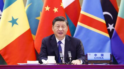 In this photo released by Xinhua News Agency, Chinese President Xi Jinping delivers a keynote speec...