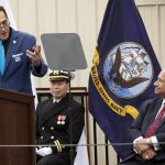 Stuart Milk, Harvey Milk's nephew and co-founder of the Harvey Milk Foundation, speaks with U.S. Navy Secretary Carlos Del Toro, right, during a ceremony before the Navy launches the USNS Harvey Milk, a fleet replenishment oiler ship named after the first openly gay elected official, in San Diego, Saturday, Nov. 6, 2021. The Navy ship is the second of six vessels in the Navy's John Lewis-class program, second to the USNS John Lewis. (AP Photo/Alex Gallardo)