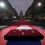 
              A coffin carrying soils from the U.S., France and Monaco will be deposited inside the Pantheon monument, rear, in Paris, France, Tuesday, Nov. 30, 2021, where Josephine Baker is to symbolically be inducted, becoming the first Black woman to receive France's highest honor. Her body will stay in Monaco at the request of her family. (AP Photo/Christophe Ena)
            