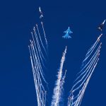 
              The Russian Knights perform a stunt after releasing chaff at the Dubai Air Show in Dubai, United Arab Emirates, Sunday, Nov. 14, 2021. The biennial Dubai Air Show opened Sunday as commercial aviation tries to shake off the coronavirus pandemic. (AP Photo/Jon Gambrell)
            