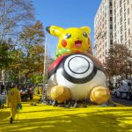 
              Crews pump helium into a balloon of Pikachu and Eevee in New York on Wednesday, Nov. 24, 2021, as the balloon is readied for the Macy's Thanksgiving Day Parade on Thursday. (AP Photo/Ted Shaffrey)
            