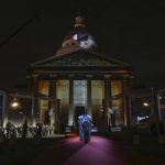 
              Six carriers of the Air Force and Space carry the cenotaph of Josephine Baker, covered with the French flag, into the Pantheon in Paris, France, Tuesday, Nov. 30, 2021, where she is to symbolically be inducted, becoming the first Black woman to receive France's highest honor. Her body will stay in Monaco at the request of her family. (Thomas Coex/Pool Photo via AP)
            