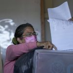 
              A voter casts her ballot during general elections in Tegucigalpa, Honduras, Sunday, Nov. 28, 2021. (AP Photo/Moises Castillo)
            