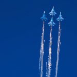 
              The Russian Knights perform a stunt after releasing chaff at the Dubai Air Show in Dubai, United Arab Emirates, Sunday, Nov. 14, 2021. The biennial Dubai Air Show opened Sunday as commercial aviation tries to shake off the coronavirus pandemic. (AP Photo/Jon Gambrell)
            
