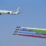 
              An Etihad Boeing 787 Dreamliner flies alongside the Emirati Forsan military stunt flying team at the Dubai Air Show in Dubai, United Arab Emirates, Sunday, Nov. 14, 2021. The biennial Dubai Air Show opened Sunday as commercial aviation tries to shake off the coronavirus pandemic. (AP Photo/Jon Gambrell)
            