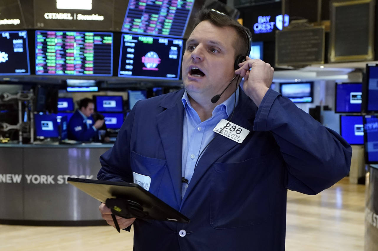 Trader Michael Milano works on the floor of the New York Stock Exchange, Monday, Nov. 29, 2021. Sto...