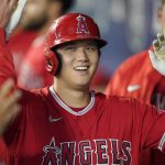 
              FILE - Los Angeles Angels' Shohei Ohtani is greeted in the dugout after he hit a solo home run during the first inning of a baseball game against the Seattle Mariners, Sunday, Oct. 3, 2021, in Seattle. On Thursday, Nov. 18, 2021, Ohtani was unanimiously voted American League MVP for a two-way season not seen since Babe Ruth. (AP Photo/Ted S. Warren, File)
            