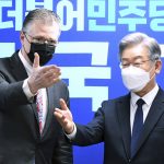 
              U.S. assistant Secretary of State for East Asian and Pacific Affairs Daniel J. Kritenbrink, left, gestures with South Korean Presidential candidate Lee Jae-myung at the ruling Democratic Party headquarters in Seoul, South Korea, Thursday, Nov. 11, 2021. Kritenbrink arrived in South Korea on Wednesday on the second leg of his two-stop Asia trip and will meet with senior government officials. (Kim Min-hee/Pool Photo via AP)
            