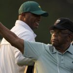 
              FILE - Lee Elder gestures as he arrives for the ceremonial tee shots before the first round of the Masters golf tournament on Thursday, April 8, 2021, in Augusta, Ga. Elder broke down racial barriers as the first Black golfer to play in the Masters and paved the way for Tiger Woods and others to follow. The PGA Tour confirmed Elder’s death, which was first reported by Debert Cook of African American Golfers Digest. No cause or details were immediately available, but the tour said it spoke with Elder's family. He was 87. (AP Photo/Charlie Riedel, File)
            