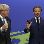 
              FILE - British Prime Minister Boris Johnson, left, greets French President Emmanuel Macron as he arrives at the COP26 U.N. Climate Summit in Glasgow, Scotland, Monday, Nov. 1, 2021. France has threatened to bar British boats from some of its ports and tighten checks on boats and trucks carrying British goods if more French vessels aren't licensed to fish in U.K. waters by Tuesday. (AP Photo/Alastair Grant, File)
            