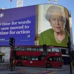 
              A picture and quotation taken from Britain's Queen Elizabeth II's address to COP26 delegates as she appears as a domination on the Piccadilly Lights, at Piccadilly Circus in London, Wednesday, Nov. 3, 2021. (AP Photo/Kirsty Wigglesworth)
            