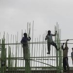 
              Laborers work at a building construction site in Mumbai, India, Tuesday, Nov. 30, 2021. India’s economy grew by 8.4% in the July-September quarter from the same period a year earlier, the government announced Tuesday, signaling hopes of a growing economic recovery after it suffered historic contractions sparked by the COVID-19 pandemic. (AP Photo/Rafiq Maqbool)
            